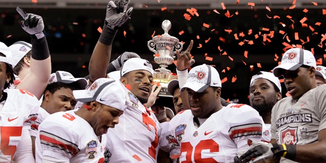 Jan. 4: Ohio State players hold up the Sugar Bowl trophy after beating Arkansas 31-26 in the NCAA college football game at the Louisiana Superdome in New Orleans.