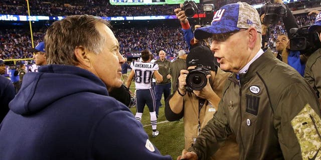 EAST RUTHERFORD, NJ - NOVEMBER 15: Head Coach Tom Coughlin of the New York Giants meets head coach Bill Belichick of the New England Patriots after the Patriots 27-26 win at MetLife Stadium on November 15, 2015 in East Rutherford, New Jersey. (Photo by Al Bello/Getty Images)