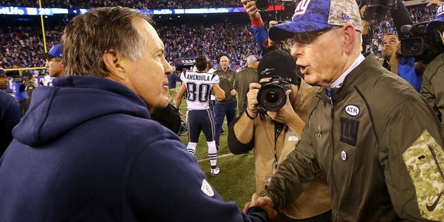 EAST RUTHERFORD, NJ - NOVEMBER 15: Head Coach Tom Coughlin of the New York Giants meets head coach Bill Belichick of the New England Patriots after the Patriots 27-26 win at MetLife Stadium on November 15, 2015 in East Rutherford, New Jersey. (Photo by Al Bello/Getty Images)