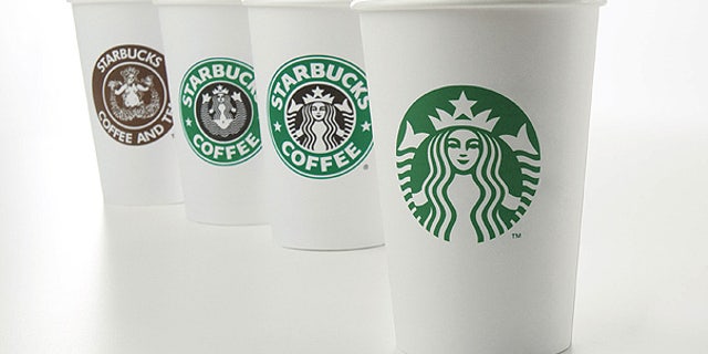 Starbucks' new 40-year anniversary logo is seen on a cup at right. The coffee giant is testing a new, super-expensive Costa Rica Finca Palmilera brew that sells for $7 a pop.