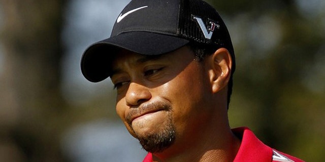 Aug. 8: Tiger Woods reacts after missing a putt during the WGC Bridgestone Invitational golf tournament in Akron, Ohio.