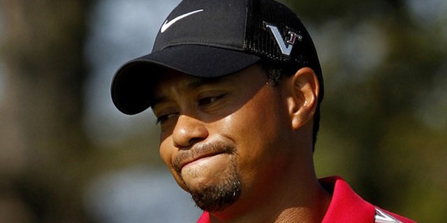 Aug. 8: Tiger Woods reacts after missing a putt during the WGC Bridgestone Invitational golf tournament in Akron, Ohio.