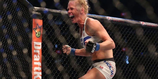 MELBOURNE, AUSTRALIA - NOVEMBER 15: Holly Holm of the United States celebrates victory over Ronda Rousey of the United States in their UFC women's bantamweight championship bout during the UFC 193 event at Etihad Stadium on November 15, 2015 in Melbourne, Australia. (Photo by Quinn Rooney/Getty Images)