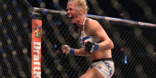 MELBOURNE, AUSTRALIA - NOVEMBER 15: Holly Holm of the United States celebrates victory over Ronda Rousey of the United States in their UFC women's bantamweight championship bout during the UFC 193 event at Etihad Stadium on November 15, 2015 in Melbourne, Australia. (Photo by Quinn Rooney/Getty Images)