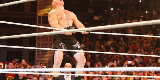 NEW YORK, NY - AUGUST 23: Brock Lesnar enters the ring at the WWE SummerSlam 2015 at Barclays Center of Brooklyn on August 23, 2015 in New York City. (Photo by JP Yim/Getty Images)