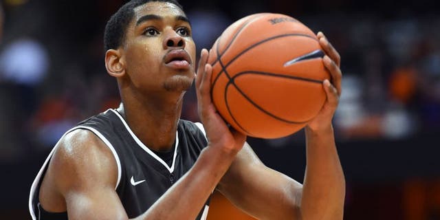 Nov 17, 2015; Syracuse, NY, USA; St. Bonaventure Bonnies forward Denzel Gregg (12) shoot a free throw against the Syracuse Orange during the second half at the Carrier Dome. Syracuse defeated St. Bonaventure 79-66. Mandatory Credit: Rich Barnes-USA TODAY Sports