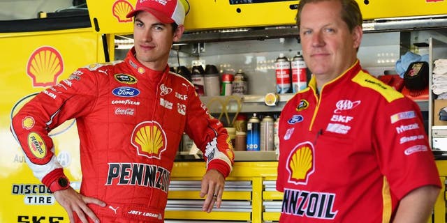 CHARLOTTE, NC - MAY 23: Joey Logano, driver of the #22 Shell Pennzoil Ford, stands in the garage area with his crew chief Todd Gordon during practice for the NASCAR Sprint Cup Series Coca-Cola 600 at Charlotte Motor Speedway on May 23, 2015 in Charlotte, North Carolina. (Photo by Jared C. Tilton/Getty Images)
