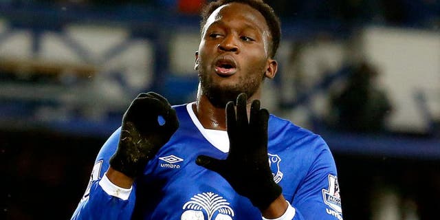 Everton's Belgian striker Romelu Lukaku celebrates scoing his team's first goal during the English Premier League football match between Everton and Crystal Palace at Goodison Park in Liverpool on December 7, 2015. AFP PHOTO / LINDESY PARNABY RESTRICTED TO EDITORIAL USE. No use with unauthorized audio, video, data, fixture lists, club/league logos or 'live' services. Online in-match use limited to 75 images, no video emulation. No use in betting, games or single club/league/player publications. / AFP / LINDSEY PARNABY (Photo credit should read LINDSEY PARNABY/AFP/Getty Images)