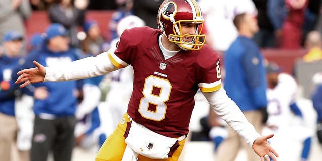 Dec 20, 2015; Landover, MD, USA; Washington Redskins quarterback Kirk Cousins (8) celebrates after throwing a touchdown pass to Redskins wide receiver DeSean Jackson (not pictured) against the Buffalo Bills in the third quarter at FedEx Field. The Redskins won 35-25. Mandatory Credit: Geoff Burke-USA TODAY Sports