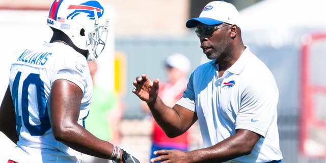 Jul 31, 2015; Pittsford, NY, USA; Buffalo Bills running backs coach Anthony Lynn instructs Karlos Williams (40) during training camp at St. John Fisher College. Mandatory Credit: Mark Konezny-USA TODAY Sports