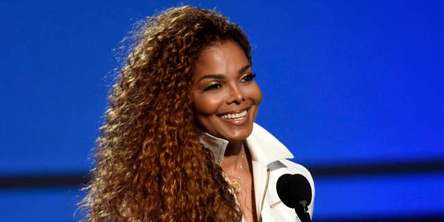 FILE - In this June 28, 2015, file photo, Janet Jackson accepts the ultimate icon: music dance visual award at the BET Awards in Los Angeles.