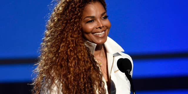 FILE - In this June 28, 2015, file photo, Janet Jackson accepts the ultimate icon: music dance visual award at the BET Awards in Los Angeles.