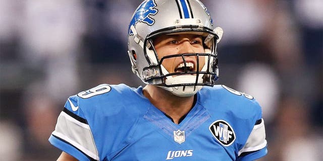 ARLINGTON, TX - JANUARY 04: Quarterback Matthew Stafford #9 of the Detroit Lions reacts in the first half while taking on the Dallas Cowboys during the NFC Wildcard Playoff Game at AT&T Stadium on January 4, 2015 in Arlington, Texas. (Photo by Ronald Martinez/Getty Images)