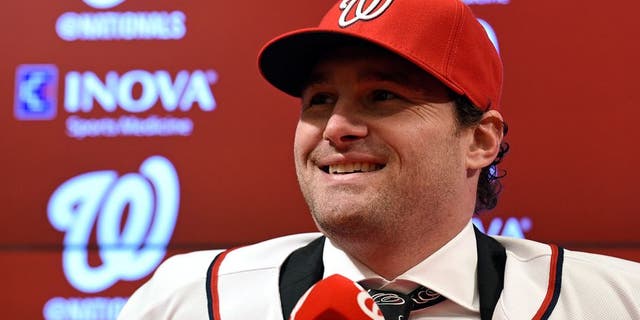 New Washington Nationals infielder Daniel Murphy speaks during a news conference at Nationals Park in Washington, Thursday, Jan. 7, 2016. Murphy's three-year contract with the Nationals will cost the team only $8 million in 2016. (AP Photo/Susan Walsh)