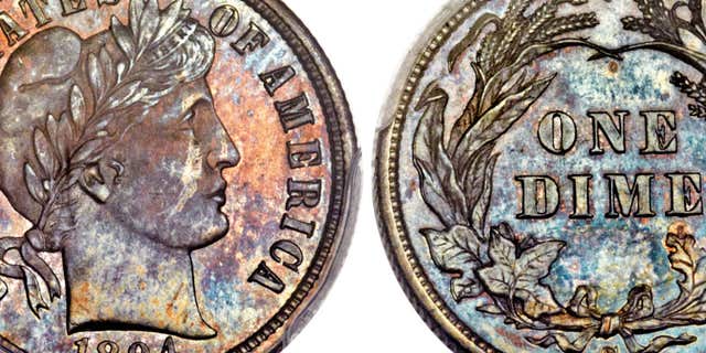This Nov. 10, 2015, photo combination provided by Heritage Auctions, shows the front and back of a rare 1894 dime that will be put up for auction Thursday Jan. 7, 2016 in Tampa, Fla.