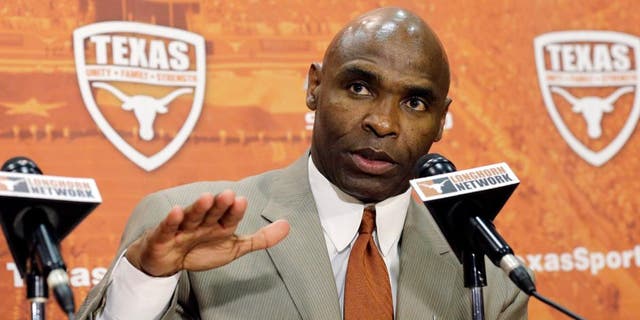 Charlie Strong answers questions during an NCAA college football news conference where Strong was introduced as the new Texas football coach, Monday, Jan. 6, 2014, in Austin, Texas. Strong replaces Mack Brown, who coached Texas for 16 years and won the 2005 national championship.