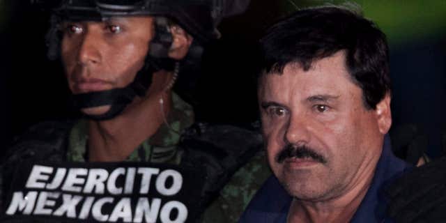 Jan. 8, 2016: Mexican drug lord Joaquin "El Chapo" Guzman, right, is escorted by soldiers and marines to a waiting helicopter, at a federal hangar in Mexico City