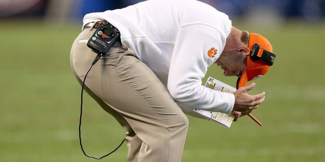 CHARLOTTE, NC - DECEMBER 05: Head coach Dabo Swinney of the Clemson Tigers reacts after a play against the North Carolina Tar Heels during the Atlantic Coast Conference Football Championship at Bank of America Stadium on December 5, 2015 in Charlotte, North Carolina. (Photo by Streeter Lecka/Getty Images)