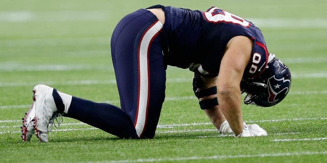 HOUSTON, TX - JANUARY 09: J.J. Watt #99 of the Houston Texans reacts in the second half against the Kansas City Chiefs during the AFC Wild Card Playoff game at NRG Stadium on January 9, 2016 in Houston, Texas. The Chiefs won 30-0 against the Texans. (Photo by Bob Levey/Getty Images)
