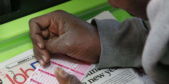 Jan. 5, 2016: Jermaine Emory Mallory fills out a Powerball number selection slip at a store in Oklahoma City/