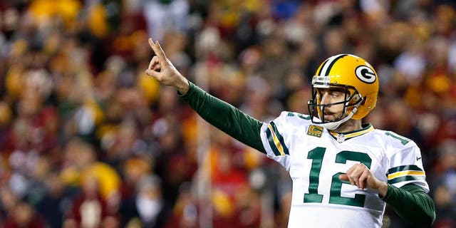 LANDOVER, MD - JANUARY 10: Quarterback Aaron Rodgers #12 of the Green Bay Packers signals to the sideline against the Washington Redskins in the fourth quarter during the NFC Wild Card Playoff game at FedExField on January 10, 2016 in Landover, Maryland. (Photo by Rob Carr/Getty Images)