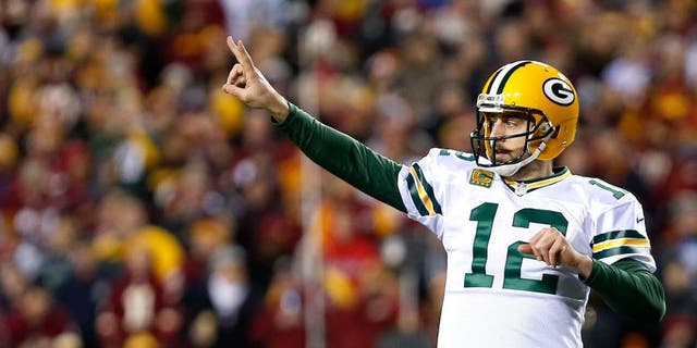 LANDOVER, MD - JANUARY 10: Quarterback Aaron Rodgers #12 of the Green Bay Packers signals to the sideline against the Washington Redskins in the fourth quarter during the NFC Wild Card Playoff game at FedExField on January 10, 2016 in Landover, Maryland. (Photo by Rob Carr/Getty Images)