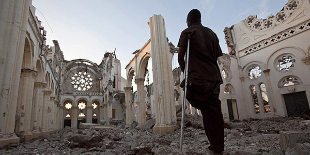 Jan. 11: Icaris Celnet stands in the ruins of The Cathedral of Our Lady of the Assumption, often called Cathédrale de Port-au-Prince in Port-au-Prince, Haiti, on the eve of the first anniversary of the earthquake that killed more than 200,000 people and displaced some 1.5 million more.