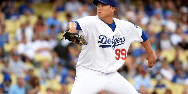 LOS ANGELES, CA - AUGUST 02: Hyun-Jin Ryu #99 of the Los Angeles Dodgers pitches against the Chicago Cubs during the first inning at Dodger Stadium on August 2, 2014 in Los Angeles, California. (Photo by Harry How/Getty Images)