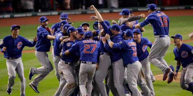 FILE - In this Nov. 3, 2016, file photo, the Chicago Cubs celebrate after Game 7 of the Major League Baseball World Series against the Cleveland Indians, in Cleveland.