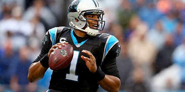 CHARLOTTE, NC - DECEMBER 22: Cam Newton #1 of the Carolina Panthers drops back to pass during their game against the New Orleans Saints at Bank of America Stadium on December 22, 2013 in Charlotte, North Carolina. (Photo by Streeter Lecka/Getty Images)