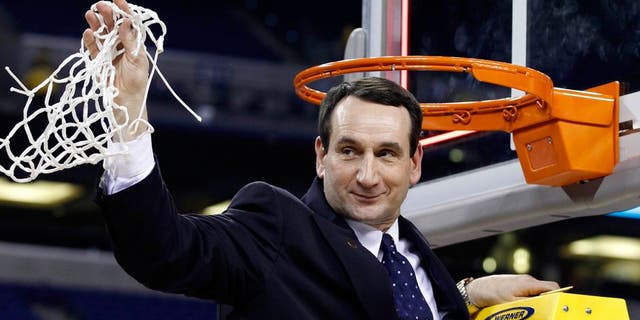 Apr 5, 2010; Indianapolis, IN, USA; Duke Blue Devils head coach Mike Krzyzewski waves to the crowd after cutting down a piece of the net after defeating the Butler Bulldogs 61-59 in the national championship game of the Final Four of the 2010 NCAA mens basketball tournament at Lucas Oil Stadium. Mandatory Credit: Bob Donnan-USA TODAY Sports