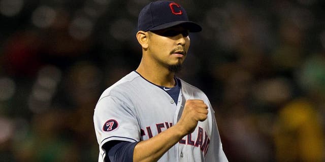 OAKLAND, CA - JULY 30: Carlos Carrasco #59 of the Cleveland Indians celebrates after the game against the Oakland Athletics at O.co Coliseum on July 30, 2015 in Oakland, California. The Cleveland Indians defeated the Oakland Athletics 3-1. (Photo by Jason O. Watson/Getty Images)