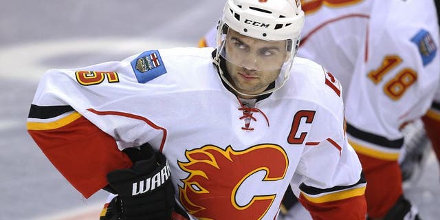 Dec 9, 2014; Toronto, Ontario, CAN; Calgary Flames defenseman Mark Giordano (5) warms up before playing against the Toronto Maple Leafs at Air Canada Centre. Mandatory Credit: Tom Szczerbowski-USA TODAY Sports