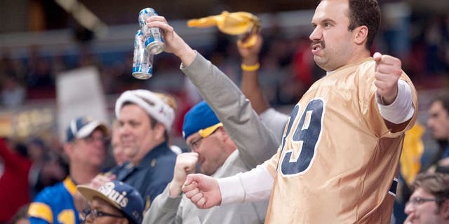 ST. LOUIS, MO - DECEMBER 17: A St. Louis Rams fans celebrates in the fourth quarter during a game against the Tampa Bay Buccaneers at the Edward Jones Dome on December 17, 2015 in St. Louis, Missouri. (Photo by Michael B. Thomas/Getty Images)