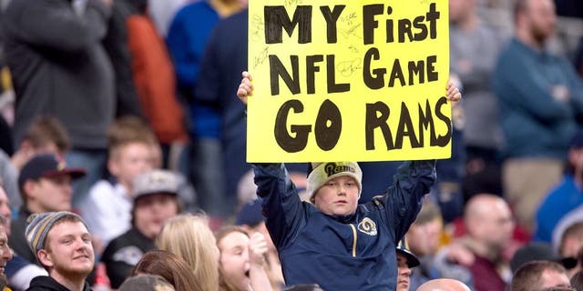 ST. LOUIS, MO - DECEMBER 17: A young St. Louis Rams fan holds a sign in the second quarter go a game against the Tampa Bay Buccaneers at the Edward Jones Dome on December 17, 2015 in St. Louis, Missouri. (Photo by Michael B. Thomas/Getty Images)