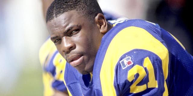 CHARLOTTE, NC - OCTOBER 13: Lawrence Phillips #21 of the St. Louis Rams looks on against the Carolina Panthers at Ericsson Stadium on October 13, 1996 in Charlotte, North Carolina. The Panthers defeated the Rams 45-13. (Photo by Joe Robbins/Getty Images)