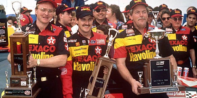 DAYTONA BEACH, FL ? February 16, 1992: Davey Allison (C) celebrates in victory lane at Daytona International Speedway with crew chief Larry McReynolds (L) and car owner Robert Yates (R) after winning the Daytona 500 NASCAR Cup race. (Photo by ISC Images & Archives via Getty Images)