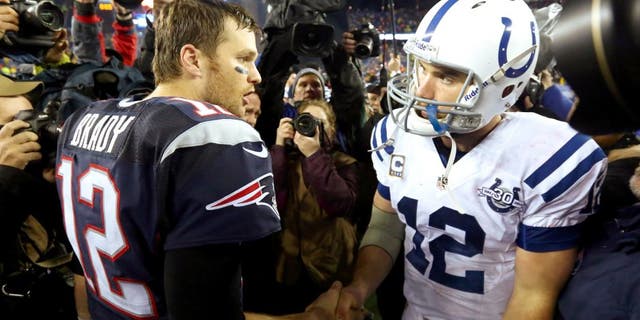 FOXBORO, MA - JANUARY 11: (L-R) Tom Brady #12 of the New England Patriots shakes hands with Andrew Luck #12 of the Indianapolis Colts after their AFC Divisional Playoff game at Gillette Stadium on January 11, 2014 in Foxboro, Massachusetts. The New England Patriots defeated the Indianapolis Colts 43 to 22. (Photo by Al Bello/Getty Images)