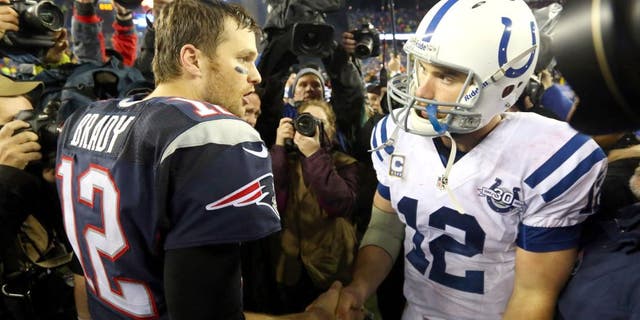 FOXBORO, MA - JANUARY 11: (L-R) Tom Brady #12 of the New England Patriots shakes hands with Andrew Luck #12 of the Indianapolis Colts after their AFC Divisional Playoff game at Gillette Stadium on January 11, 2014 in Foxboro, Massachusetts. The New England Patriots defeated the Indianapolis Colts 43 to 22. (Photo by Al Bello/Getty Images)