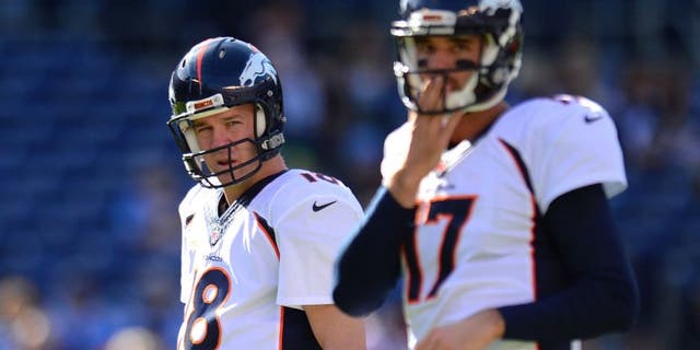 Dec 14, 2014; San Diego, CA, USA; Denver Broncos quarterback Peyton Manning (18) and quarterback Brock Osweiler (17) before the game against the San Diego Chargers at Qualcomm Stadium. Mandatory Credit: Jake Roth-USA TODAY Sports