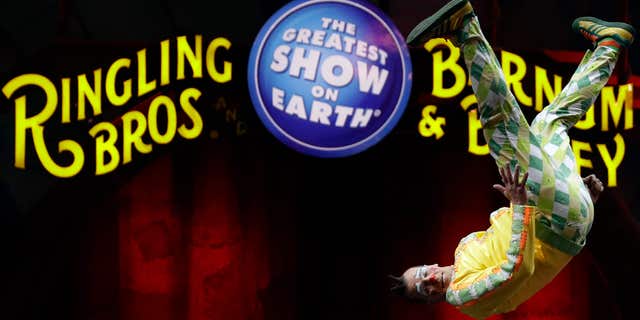 A Ringling Bros. and Barnum & Bailey clown does a somersault during a performance Saturday, Jan. 14, 2017, in Orlando, Fla.