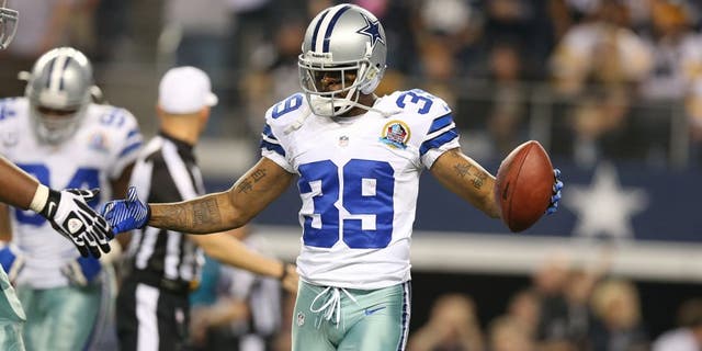 Dec 16, 2012; Arlington, TX, USA; Dallas Cowboys cornerback Brandon Carr (39) celebrates an interception in overtime against the Pittsburgh Steelers at Cowboys Stadium. The Cowboys beat the Steelers 27-24 in overtime. Mandatory Credit: Matthew Emmons-USA TODAY Sports