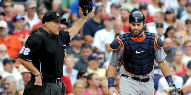 BOSTON, MA - SEPTEMBER 2: Alex Avila #13 of the Detroit Tigers calls for timeout from homeplate umpire Eric Cooper #56 in the seventh inning against the Boston Red Sox at Fenway Park on September 2, 2013 in Boston, Massachusetts. The Tigers won 3-0. (Photo by Darren McCollester/Getty Images)