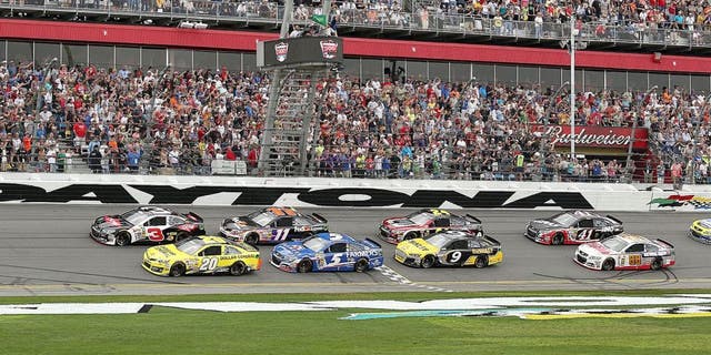 Austin Dillon (3) leads Matt Kenseth (20), Kasey Kahne (5), Denny Hamlin (11), Marcus Ambrose (9), Jeff Gordon (24), and Kurt Busch (41) to the start of the Daytona 500 at Daytona International Speedway in Daytona Beach, Fla., on Sunday, Feb. 23, 2014. (Stephen M. Dowell/Orlando Sentinel/MCT)