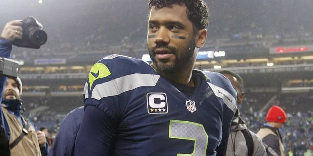 January 10, 2015; Seattle, WA, USA; Seattle Seahawks quarterback Russell Wilson (3) following the 31-17 victory against the Carolina Panthers in the 2014 NFC Divisional playoff football game at CenturyLink Field. Mandatory Credit: Joe Nicholson-USA TODAY Sports