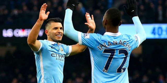 MANCHESTER, ENGLAND - JANUARY 16: Sergio Aguero of Manchester City celebrates with team-mate Kelechi Iheanacho after scoring his team's second goal during the Barclays Premier League match between Manchester City and Crystal Palace at Etihad Stadium on January 16, 2016 in Manchester, England. (Photo by Alex Livesey/Getty Images)