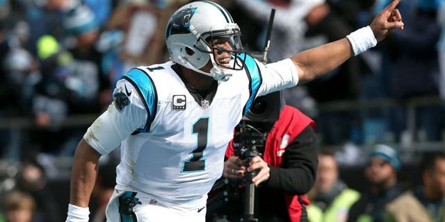 CHARLOTTE, NC - JANUARY 17: Cam Newton #1 of the Carolina Panthers celebrates after a touchdown during the NFC Divisional Playoff Game against the Seattle Seahawks at Bank of America Stadium on January 17, 2016 in Charlotte, North Carolina. (Photo by Streeter Lecka/Getty Images)