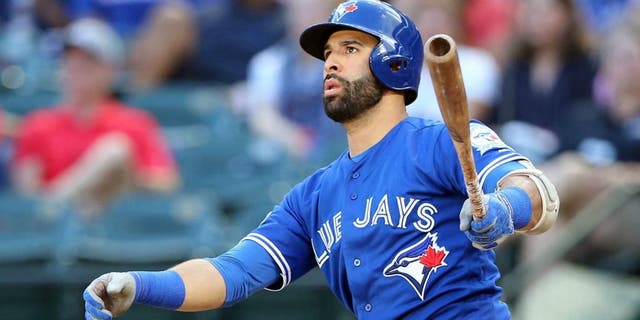 October 6, 2016; Arlington, TX, USA; Toronto Blue Jays right fielder Jose Bautista (19) hits a three run home run in the ninth inning against the Texas Rangers during game one of the 2016 ALDS playoff baseball game at Globe Life Park in Arlington. Mandatory Credit: Kevin Jairaj-USA TODAY Sports
