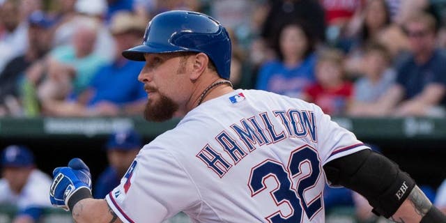 Aug 15, 2015; Arlington, TX, USA; Texas Rangers left fielder Josh Hamilton (32) bats against the Tampa Bay Rays during the game at Globe Life Park in Arlington. The Rangers defeated the Rays 12-4. Mandatory Credit: Jerome Miron-USA TODAY Sports