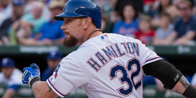 Aug 15, 2015; Arlington, TX, USA; Texas Rangers left fielder Josh Hamilton (32) bats against the Tampa Bay Rays during the game at Globe Life Park in Arlington. The Rangers defeated the Rays 12-4. Mandatory Credit: Jerome Miron-USA TODAY Sports